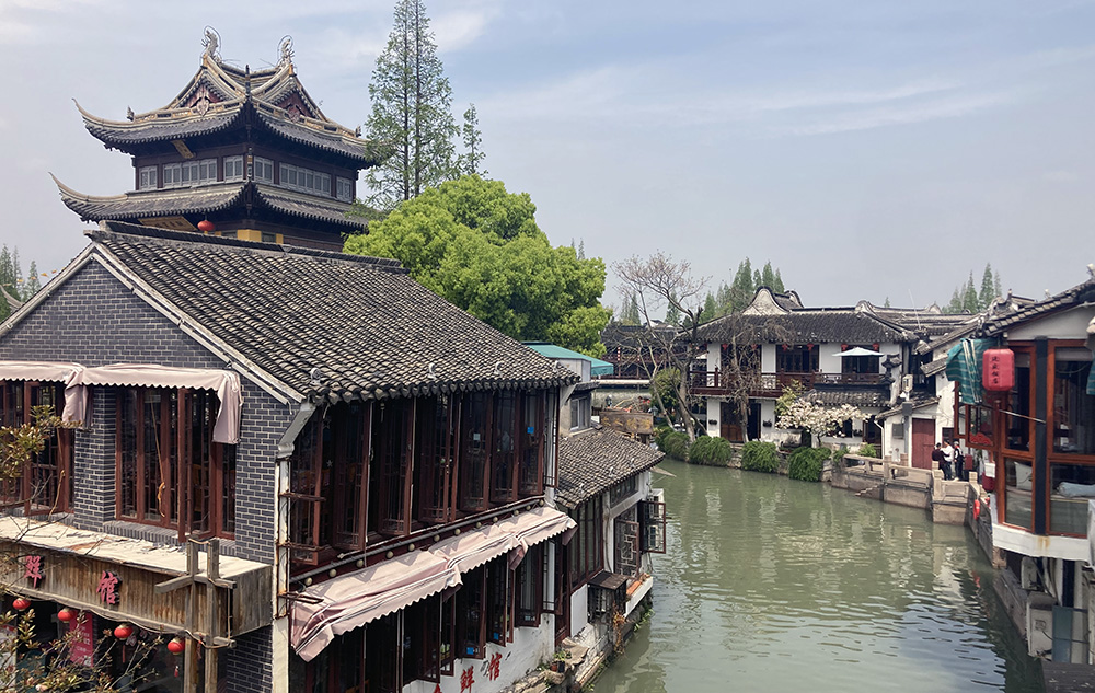Old traditional Chinese building lining a canal