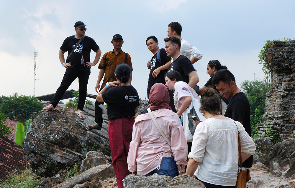 The Leadership network members standing on a rocky outcrop looking at a view